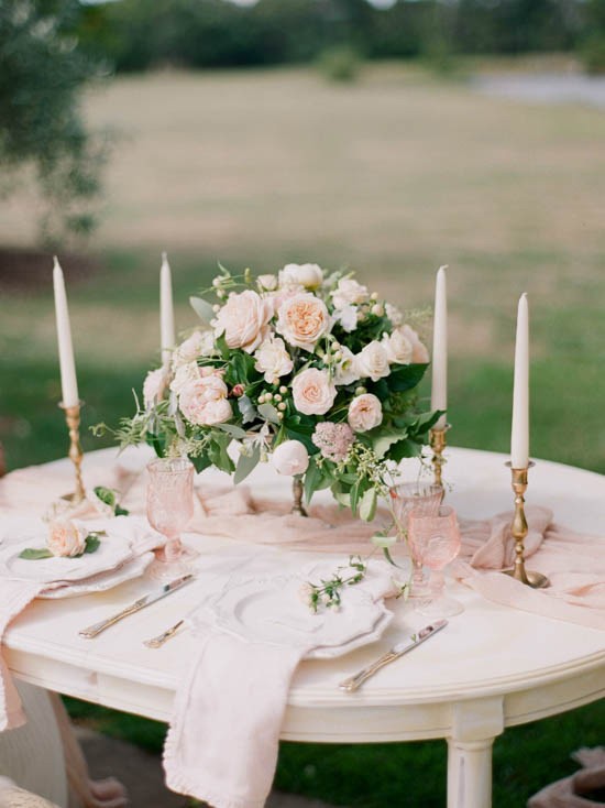 Pink and peach rose tablescape with gold candlesticks