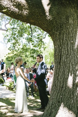Wedding ceremony under oak tree