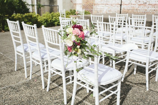 White tiffany chairs with flowers
