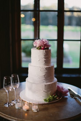 White wedding cake with pink peonies