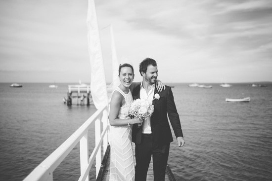 Black and white wedding photo on a pier
