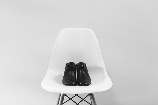 Black shoes on white chair