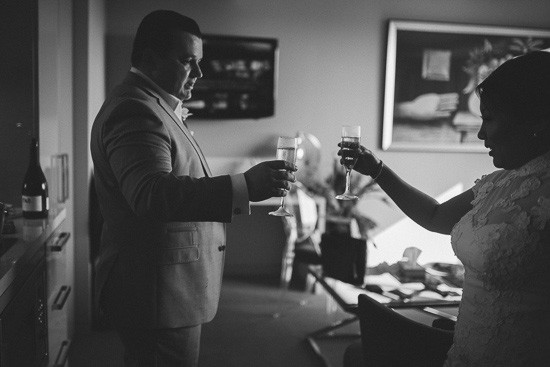 Bride and groom toasting on wedding day