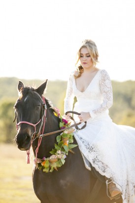 Bride on horse in wedding dress