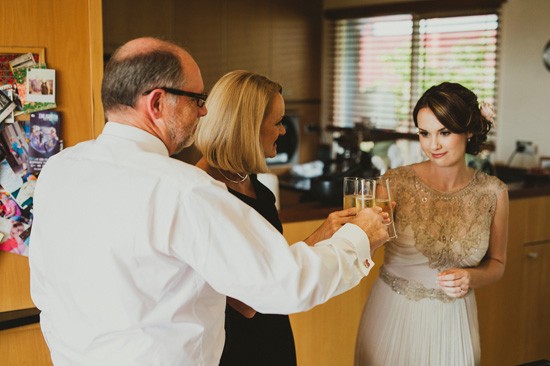 Bride toasting champagne with parents