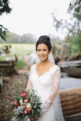 Bride wearing long sleeve wedding dress