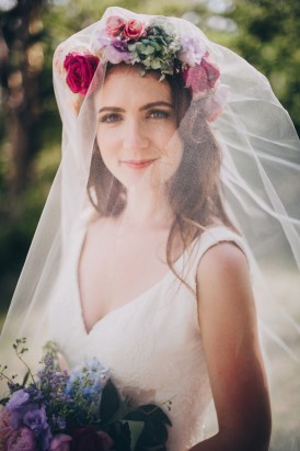 Bride with bright flower crown and veil