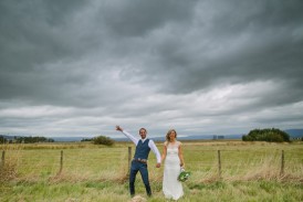 Country wedding photo with stormy sky