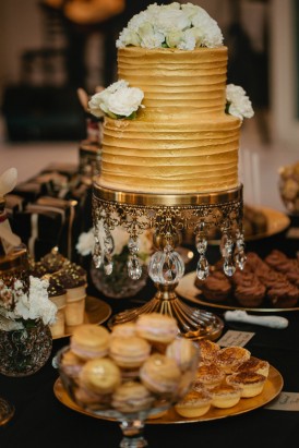 Gold wedding cake with sweets