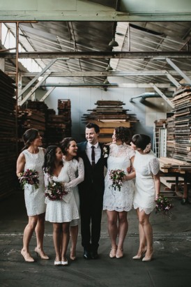 Groom with bridesmaids in white dresses