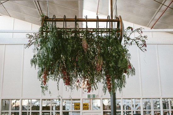 Hanging greenery centrepiece at wedding