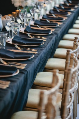 Long tables at weddin with black linen
