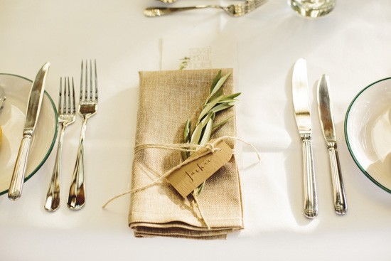 Olive branch on napkin at wedding