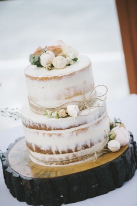 Semi naked wedding cake with cream flowers