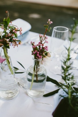 Wedding centrepieces with small bottles
