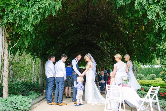 Wedding under wisteria arch