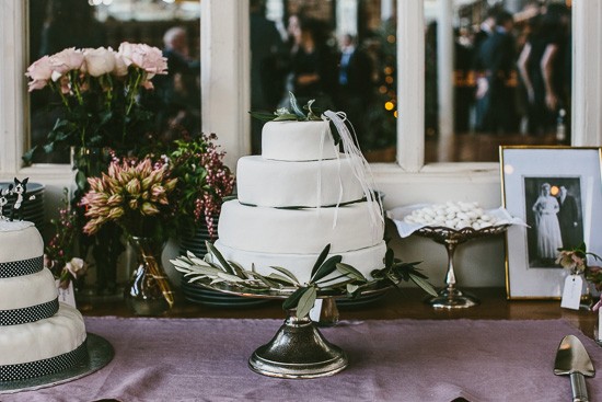 White wedding cake with olive branches