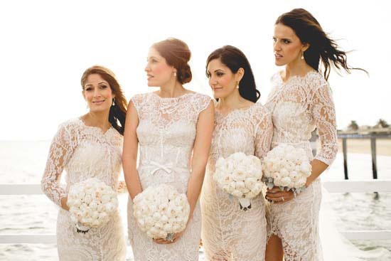 Bride-with-bridesmaids-in-white-lace-550x367