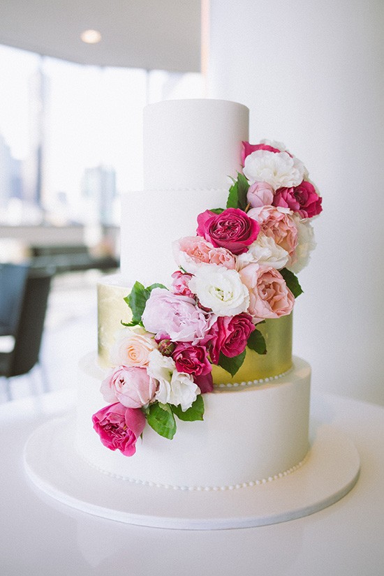 Gold wedding cake with pink peonies