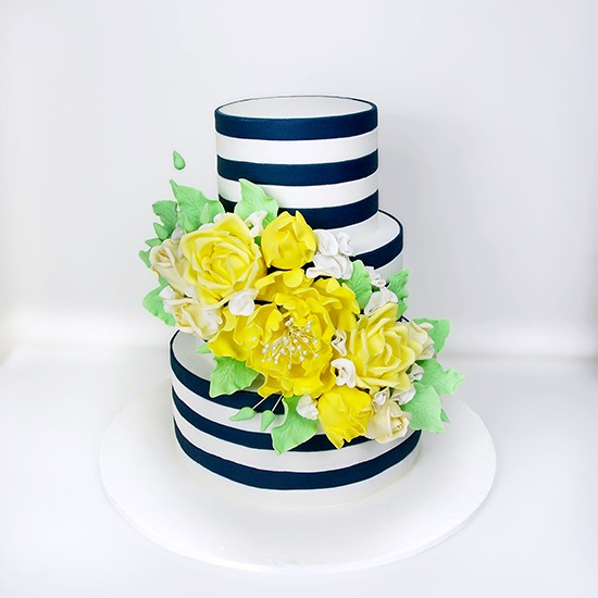 Navy and white striped cake with yellow flowers