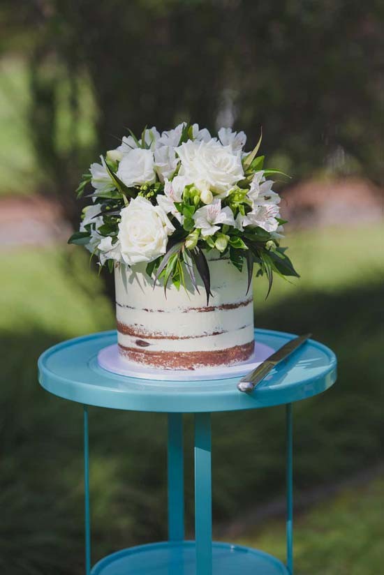 Semi Naked Wedding Cake With White Flowers