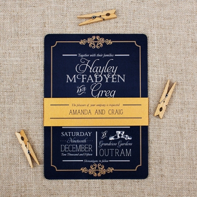 Navy wedding invitation with mustard belly band